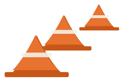 Three orange training cones on square bases, standing in a row at different distances.