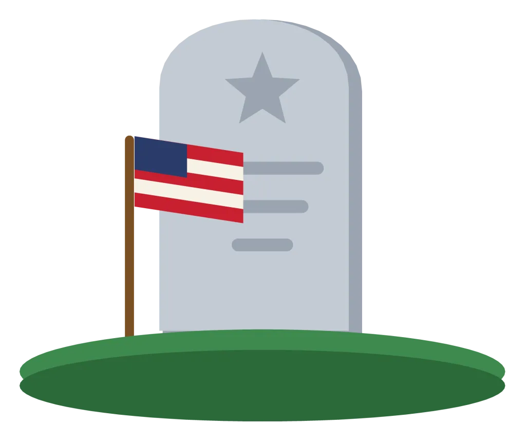 A small American flag planted in the grass beside a rounded headstone.