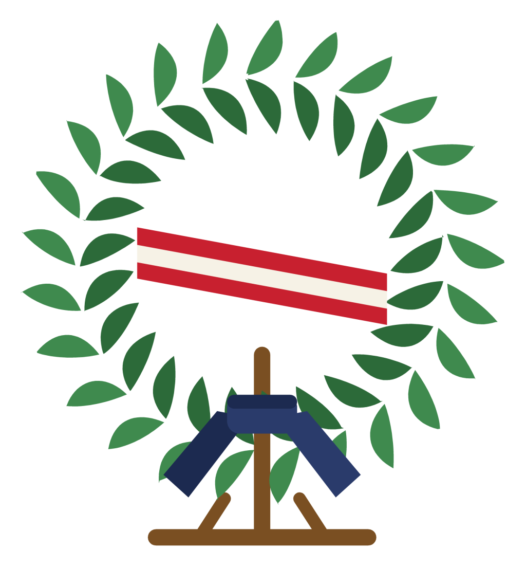 A green memorial wreath on a stand with a red, white and blue ribbon across it.