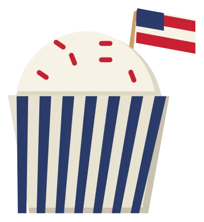 A cupcake in a striped case with white frosting, red sprinkles and a small flag on a stick.