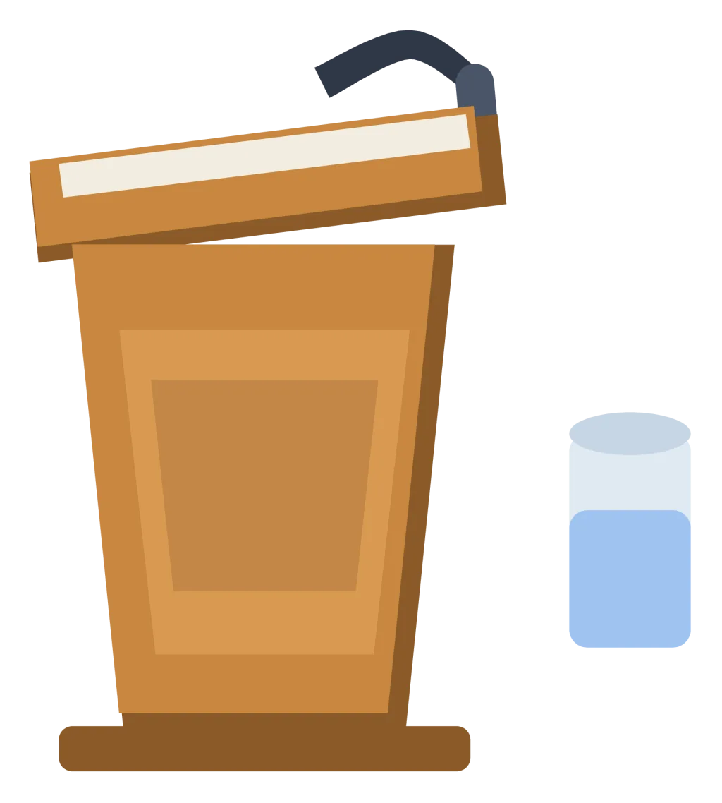 A wooden speaking podium with a slanted top, a microphone and a glass of water beside it.