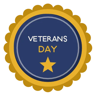 A round badge with a scalloped gold rim reading Veterans Day in two lines above a star.